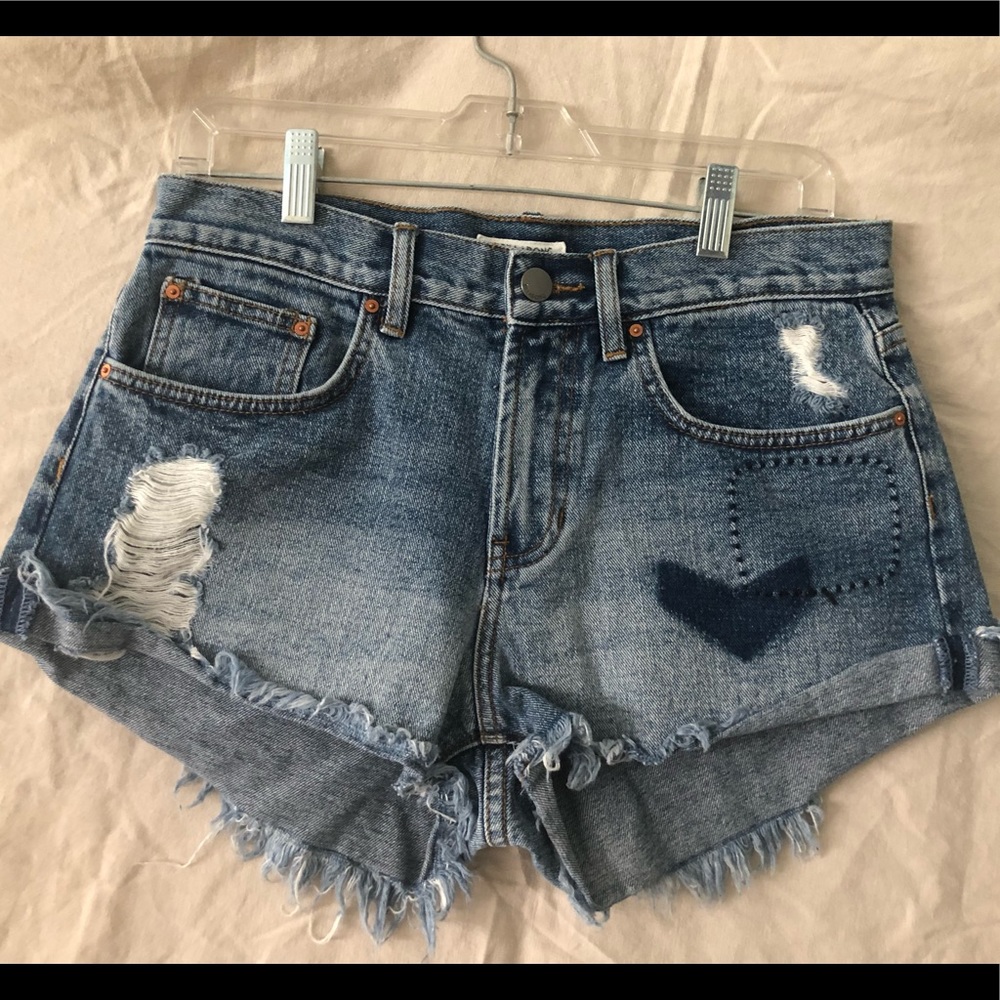 Distressed denim cutoff shorts